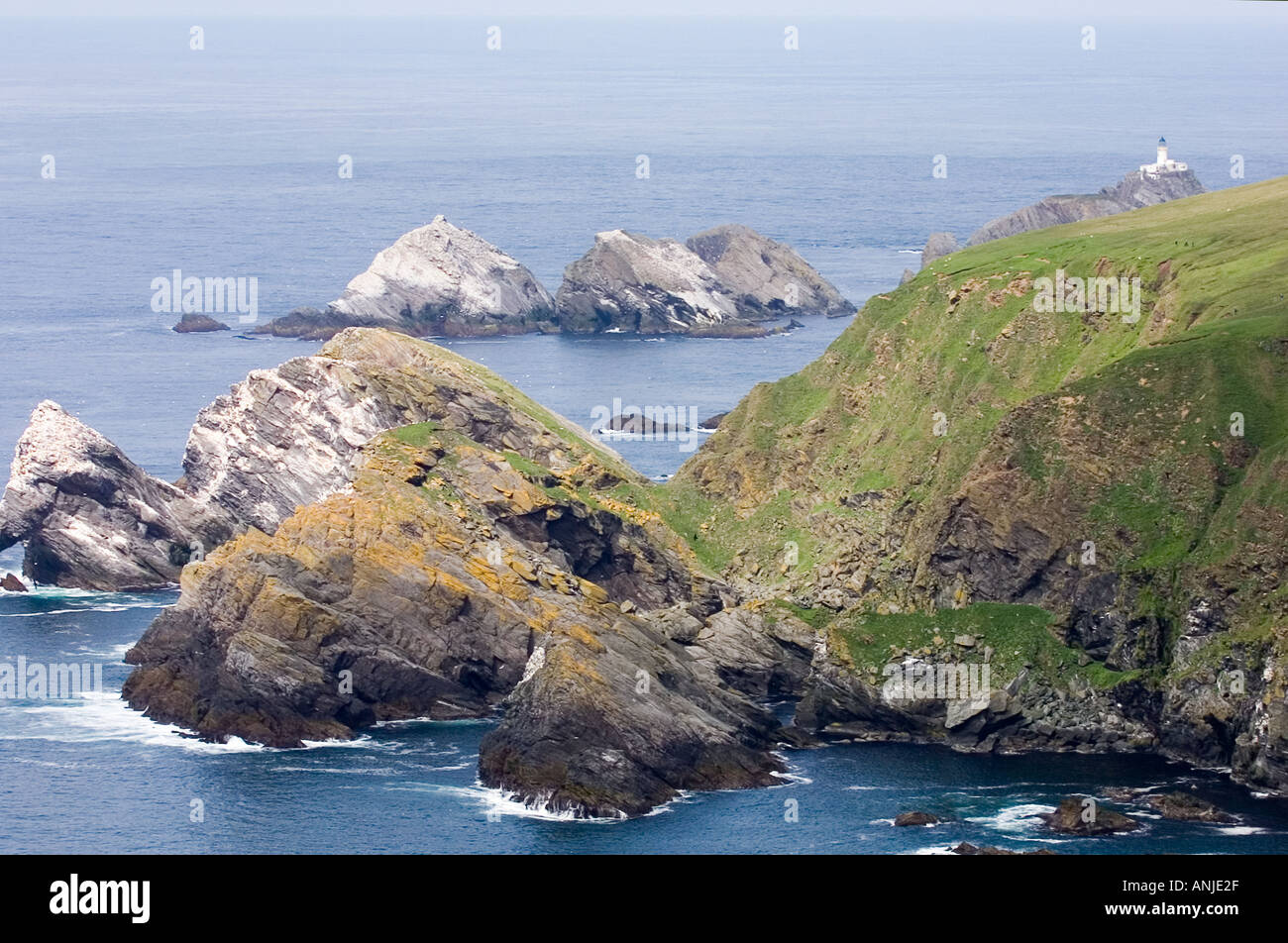 Muckle Flugga lighthouse most northerly point in the British Isles with gannet colonies Hermaness on Unst Shetland Isles Stock Photo