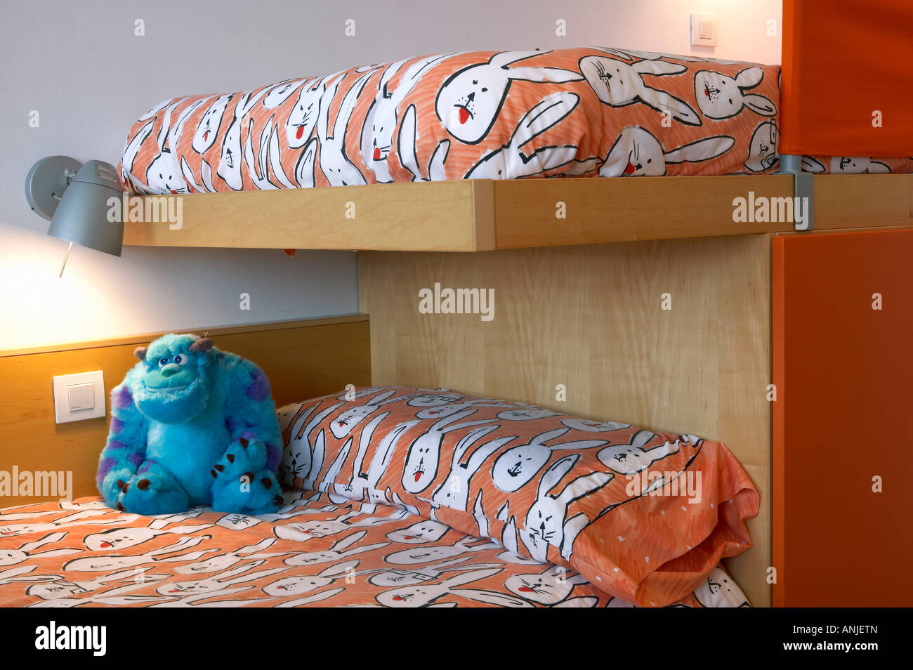 Children s room with stuffed toy on bed Stock Photo