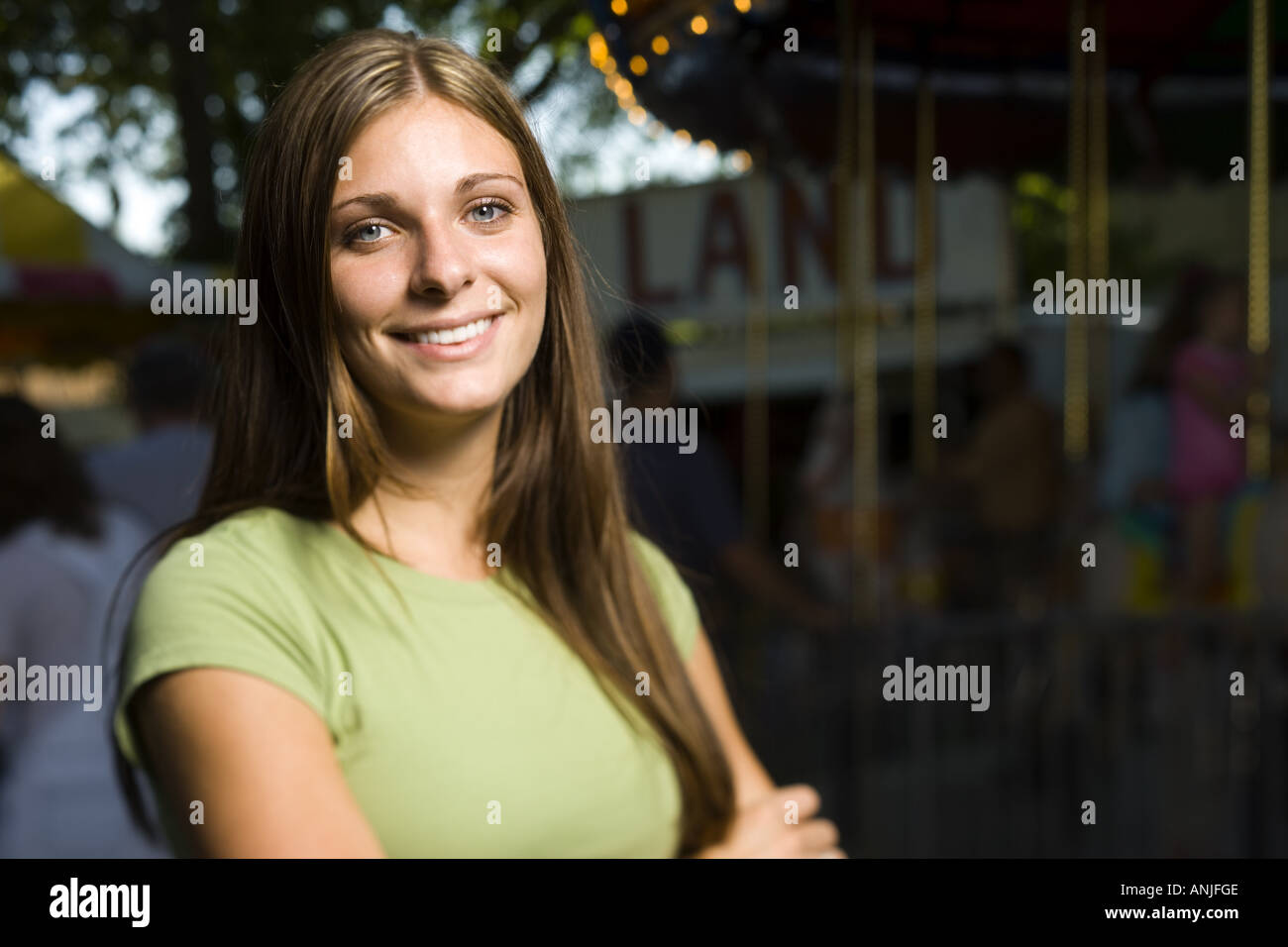 Portrait of a young woman standing with her arms crossed Stock Photo ...
