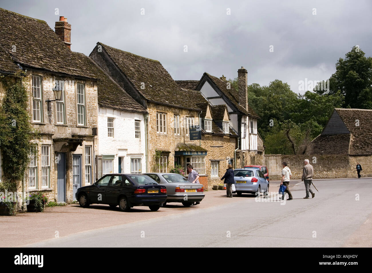 UK England Wiltshire Lacock visitors in High Street Stock Photo