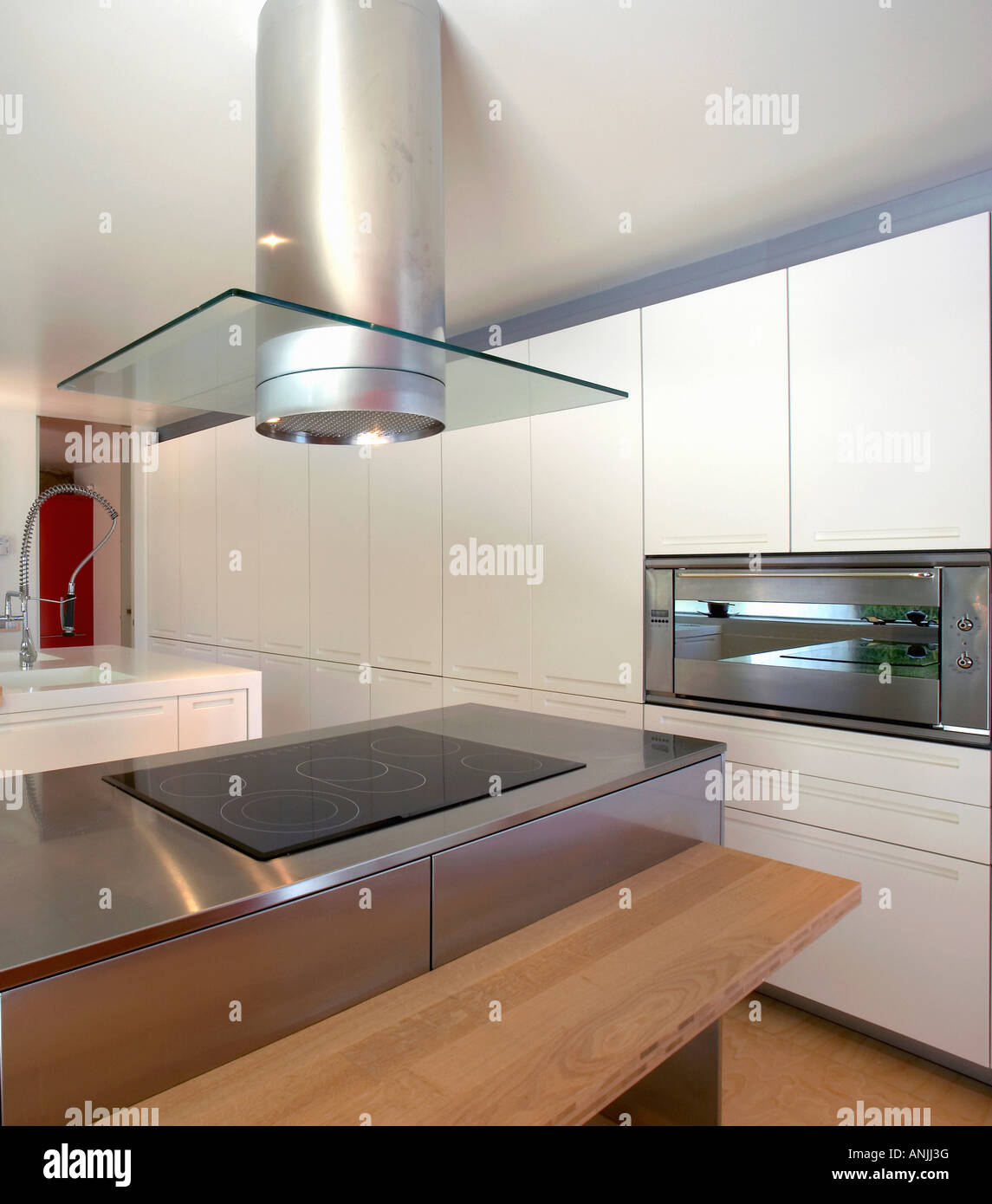 Kitchen with vent over stove top and countertop Stock Photo