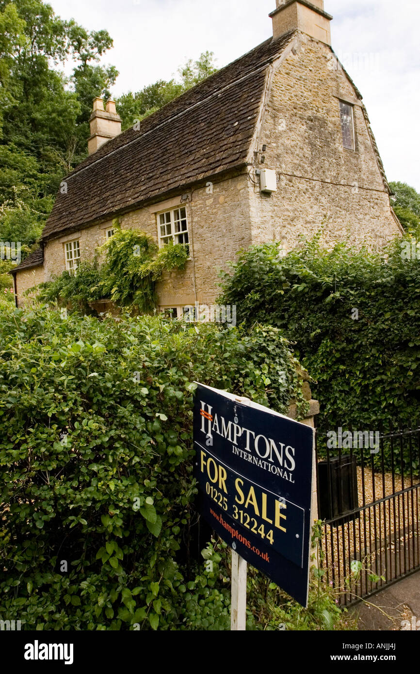 UK Wiltshire Castle Combe High Street character property for sale Stock Photo