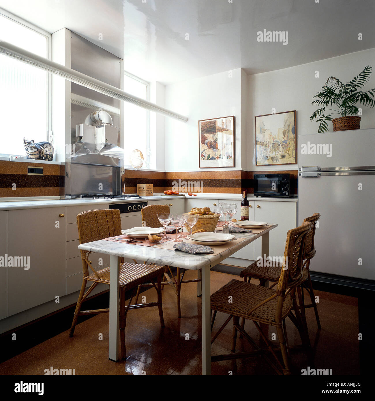 View of a dining table in a kitchen Stock Photo - Alamy