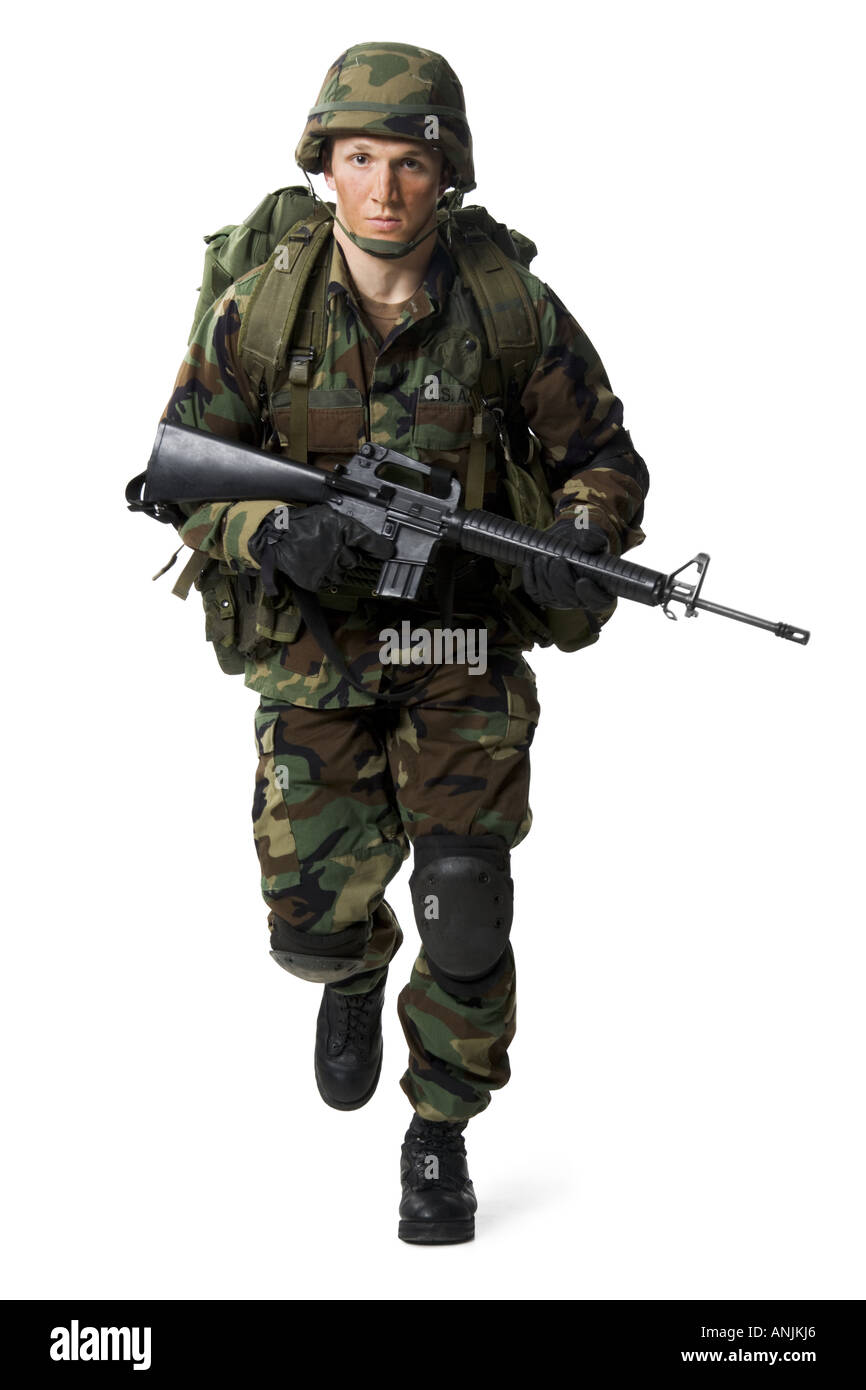 Portrait of a soldier walking with a rifle Stock Photo - Alamy