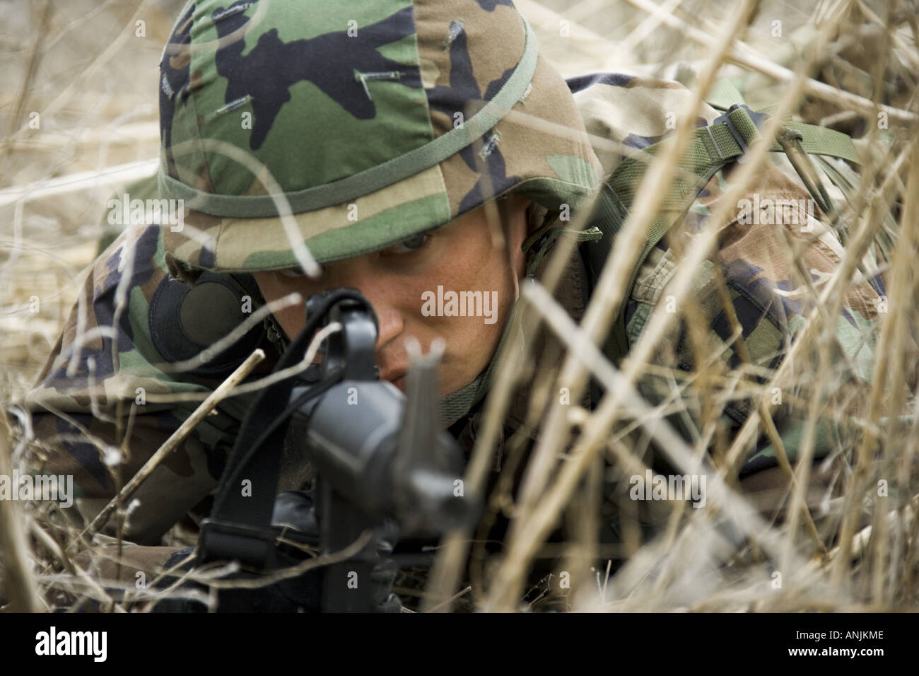Close up of a soldier aiming his rifle Stock Photo