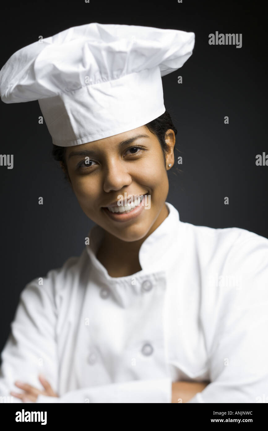 Portrait of a female chef smiling Stock Photo