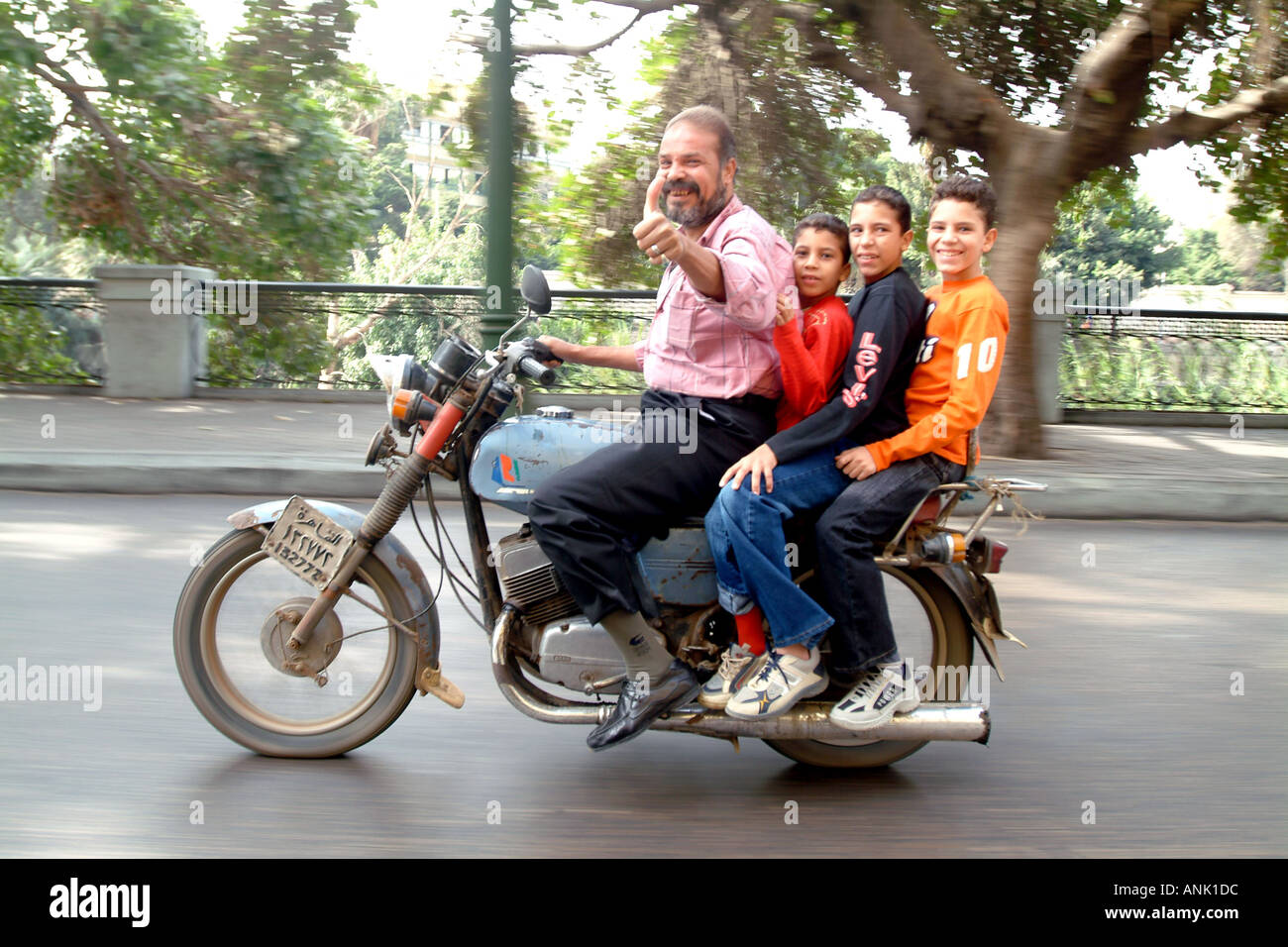 Egyptians on a motorcycle in Cairo Stock Photo Alamy
