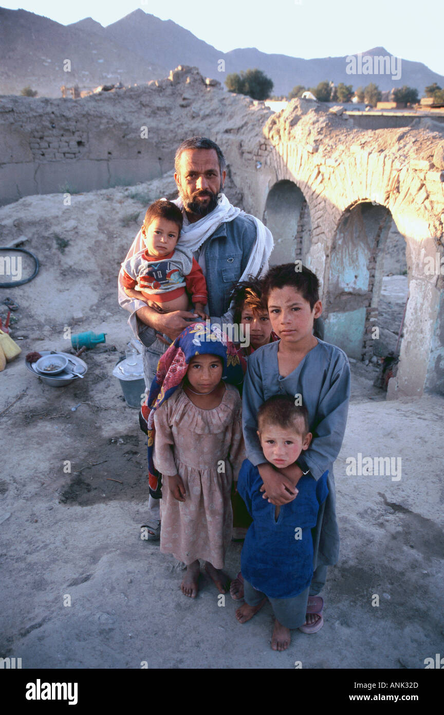 Portrait Of Pakistani Refugee Family Living In The Ruins Of West Kabul Afghanistan Stock Photo