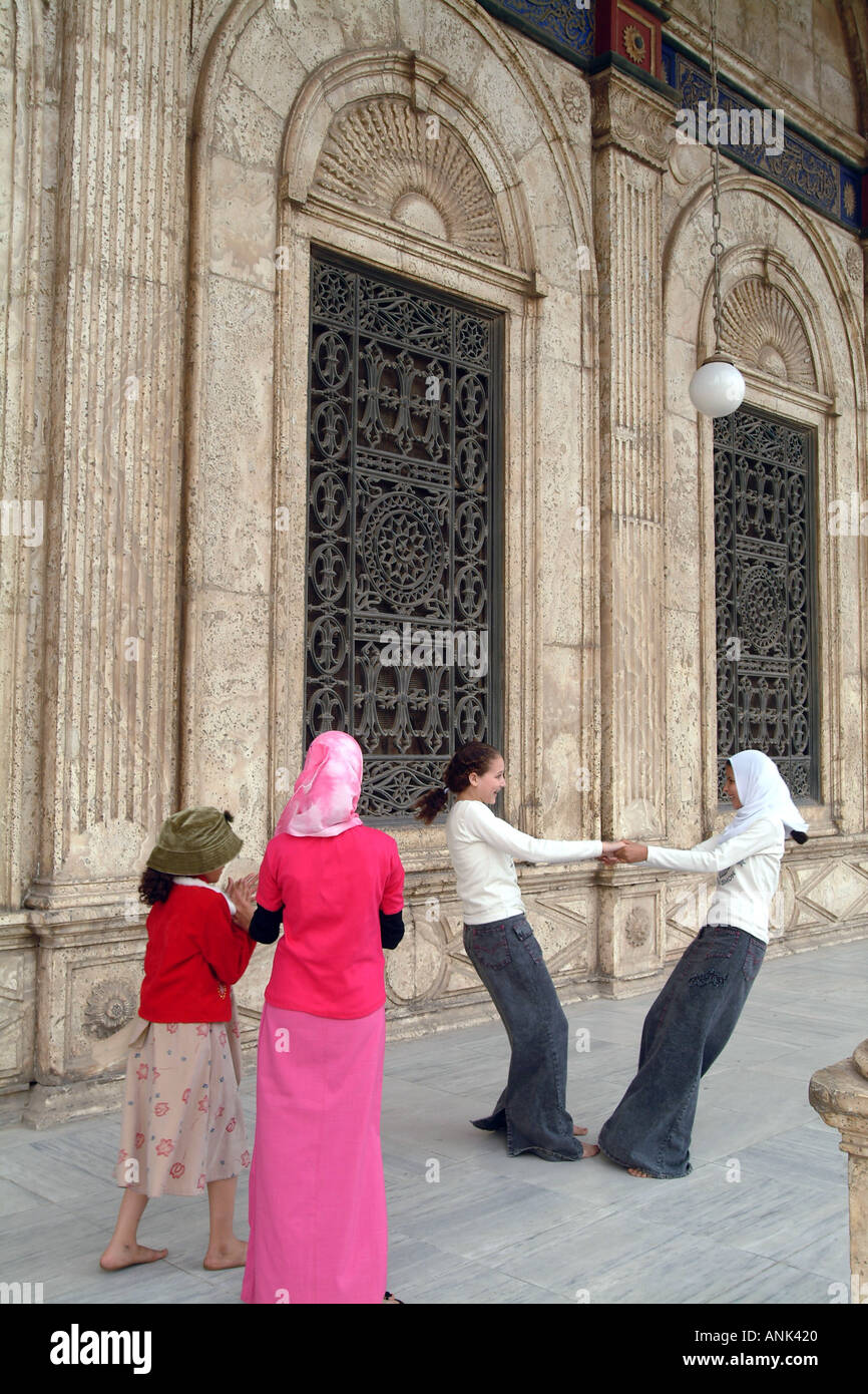 Egyptian girls dancing outside the Mohammed Ali Mosque in Cairo