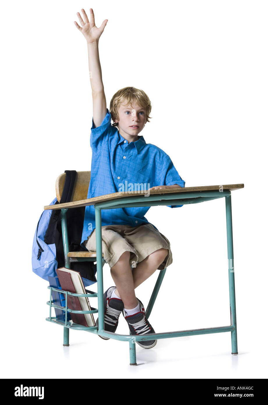 Boy raising his hand in class Stock Photo Alamy