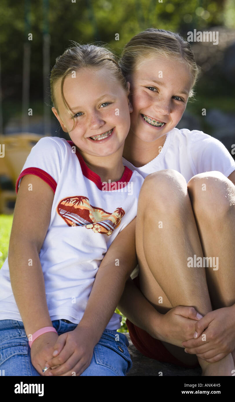 Portrait of two girls smiling Stock Photo - Alamy
