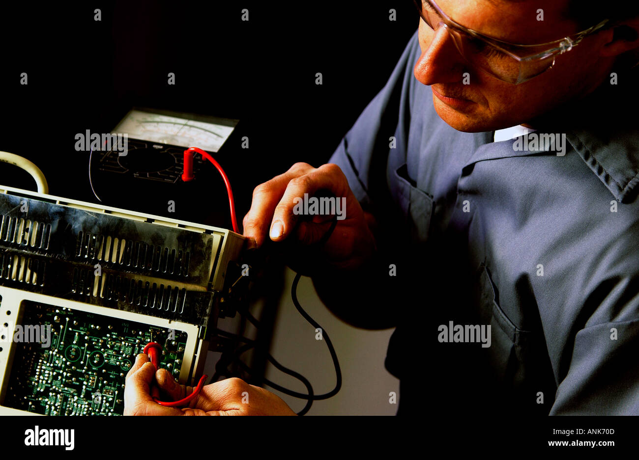 Technician repairing electronics item Stock Photo