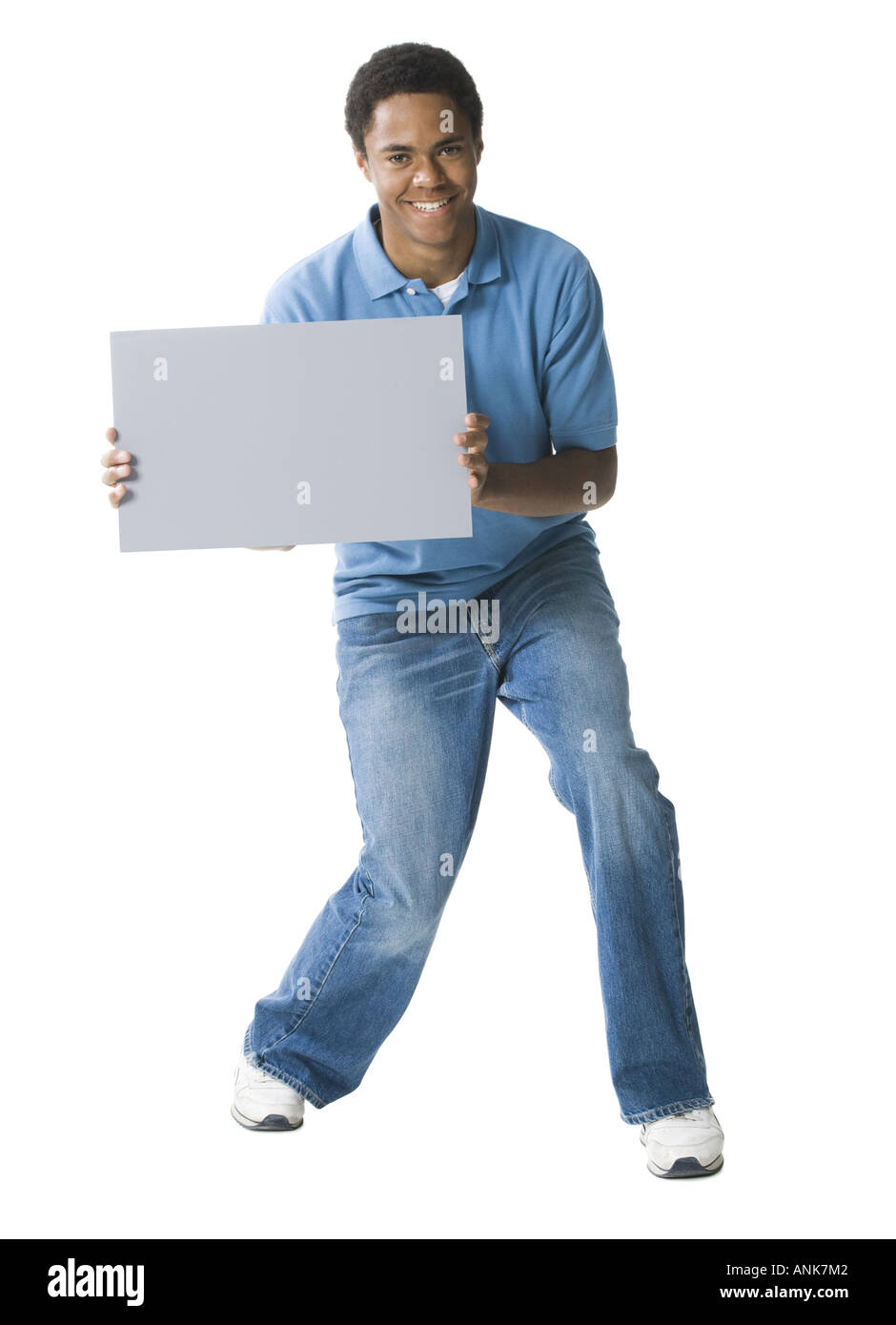 Portrait of a teenage boy holding a blank sign Stock Photo - Alamy
