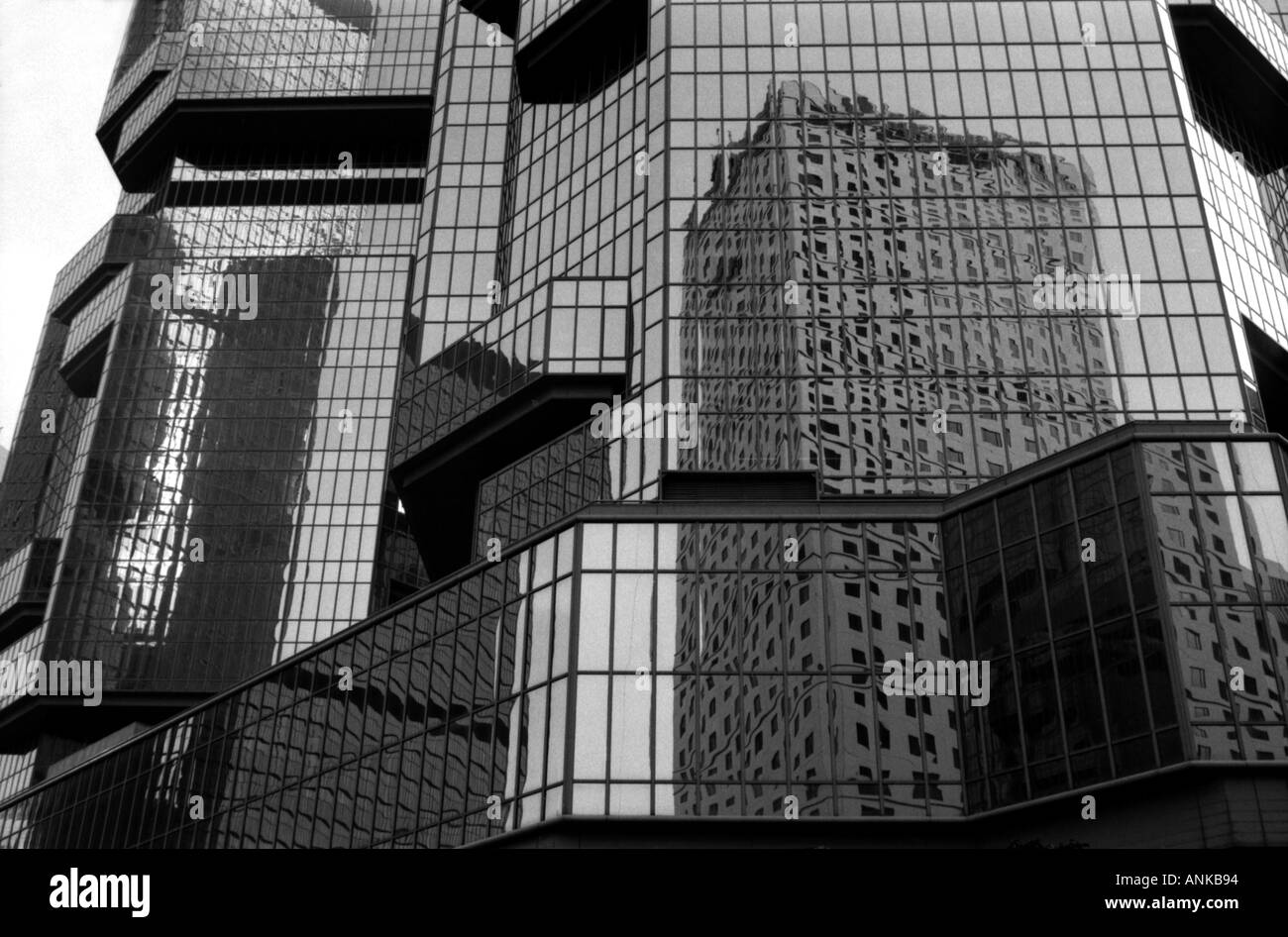 Black and white image of reflections in high rise building in Hong Kong ...