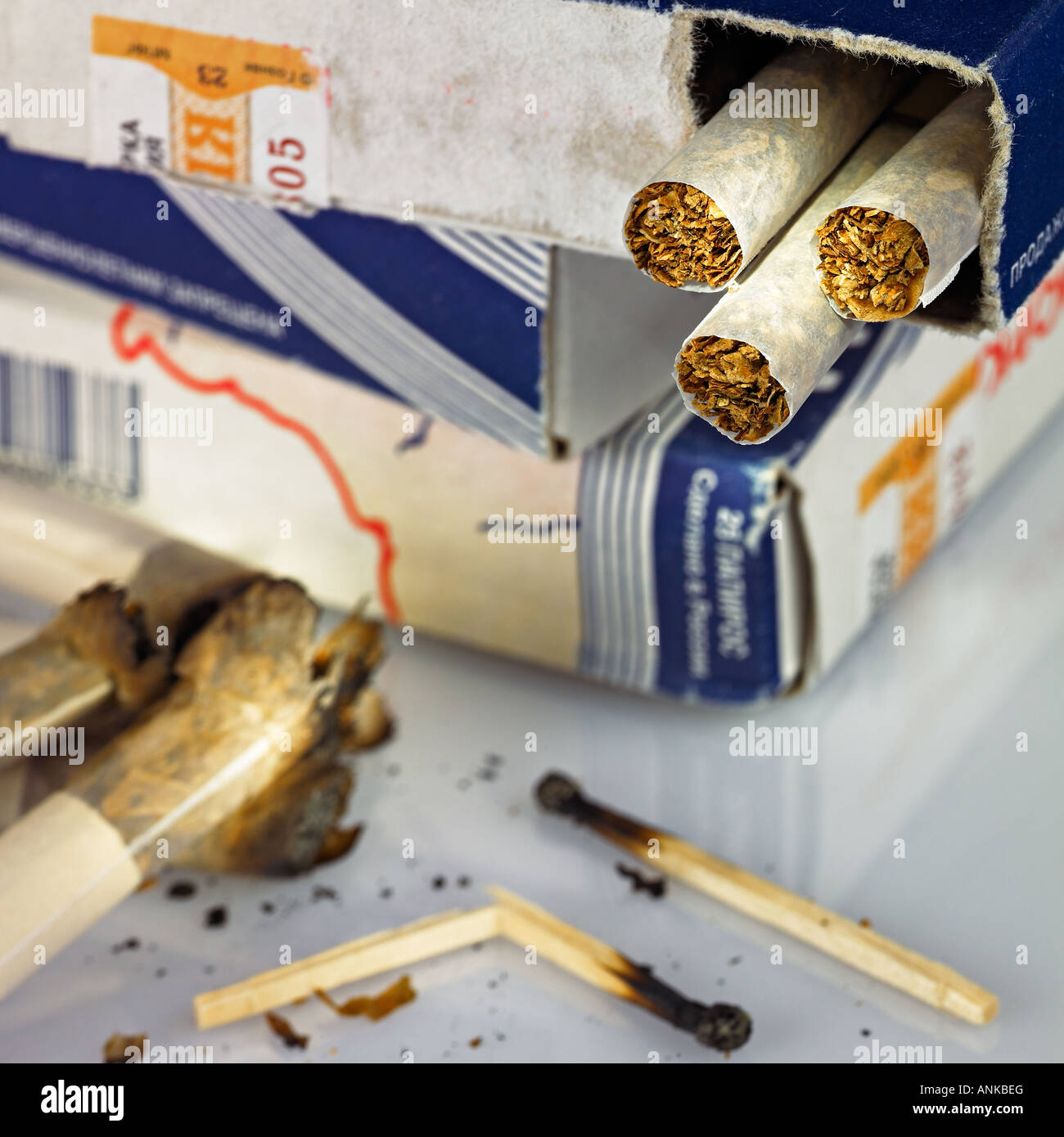 Open cigarette box and matches Stock Photo Alamy