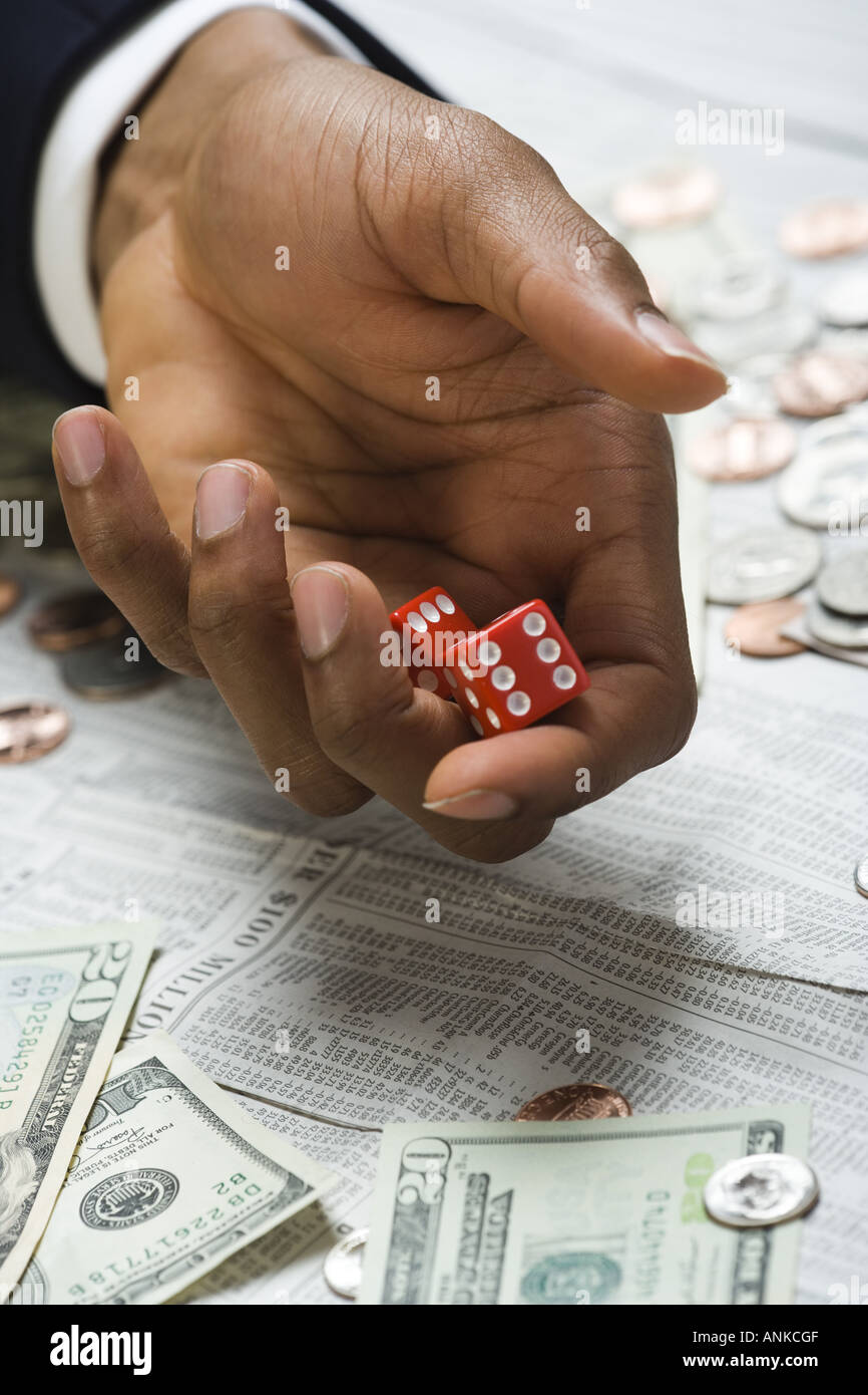 Man rolling dice Stock Photo