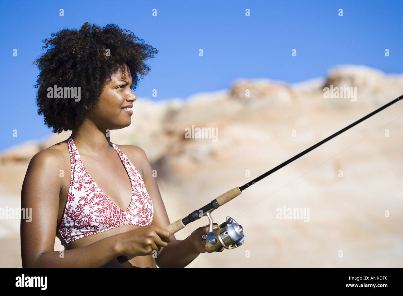 Close up of a young woman fishing Stock Photo - Alamy