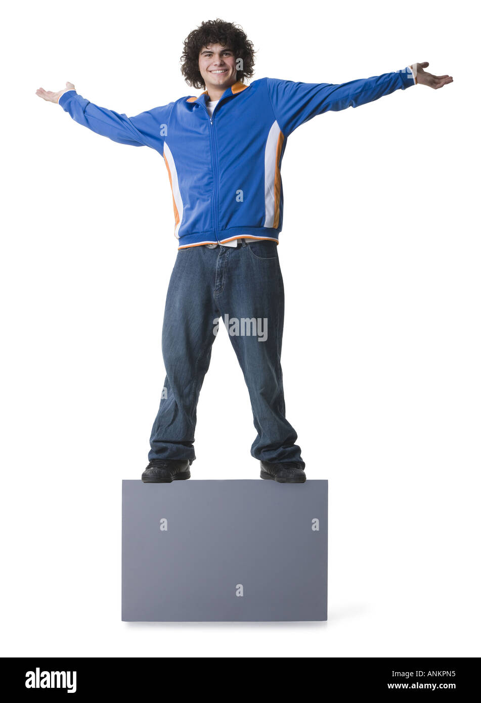 Portrait of a teenage boy standing on a blank sign and smiling Stock ...