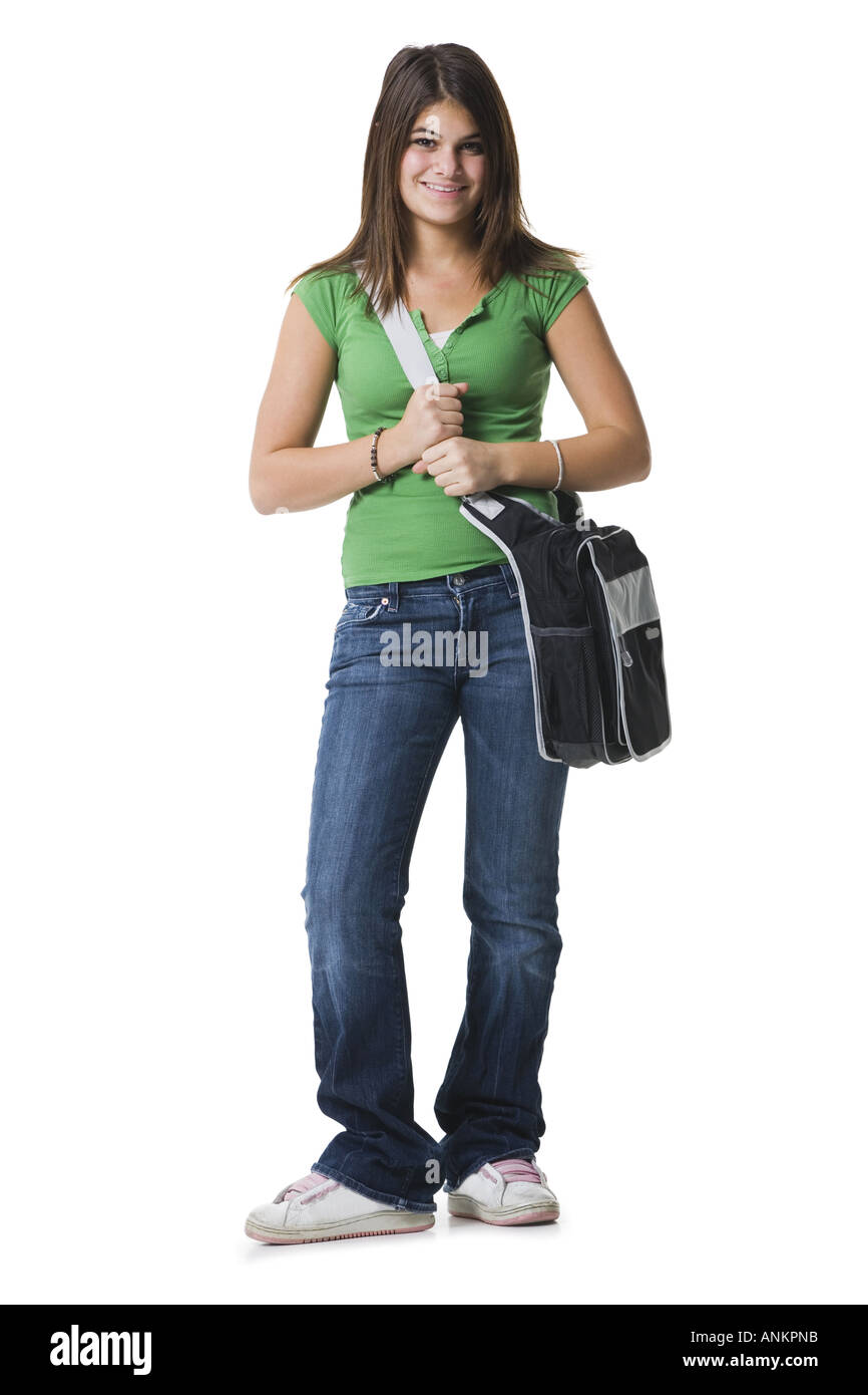 Portrait of a teenage girl holding a bag and smiling Stock Photo - Alamy