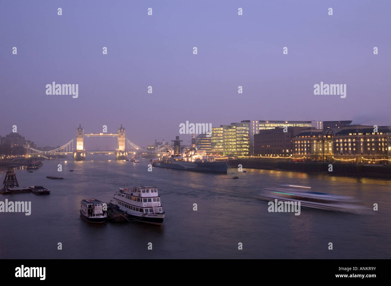 London, England. Boats along the Thames River with Tower Bridge in the background. Stock Photo