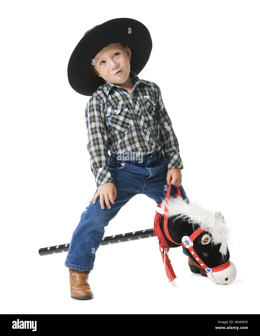 Boy riding a hobby horse Stock Photo Alamy