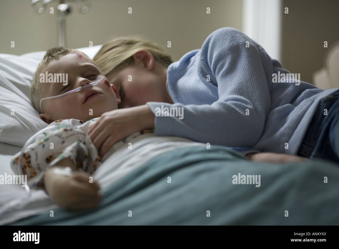 Sister sleeping with her brother on a hospital bed Stock Photo - Alamy