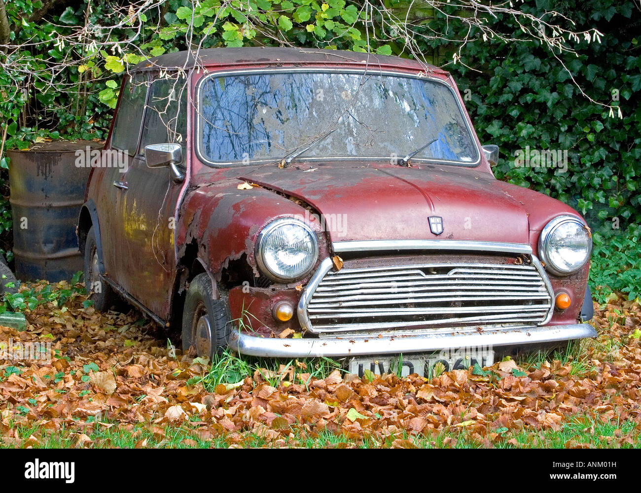 old broken rusted red car (old mini Stock Photo Alamy