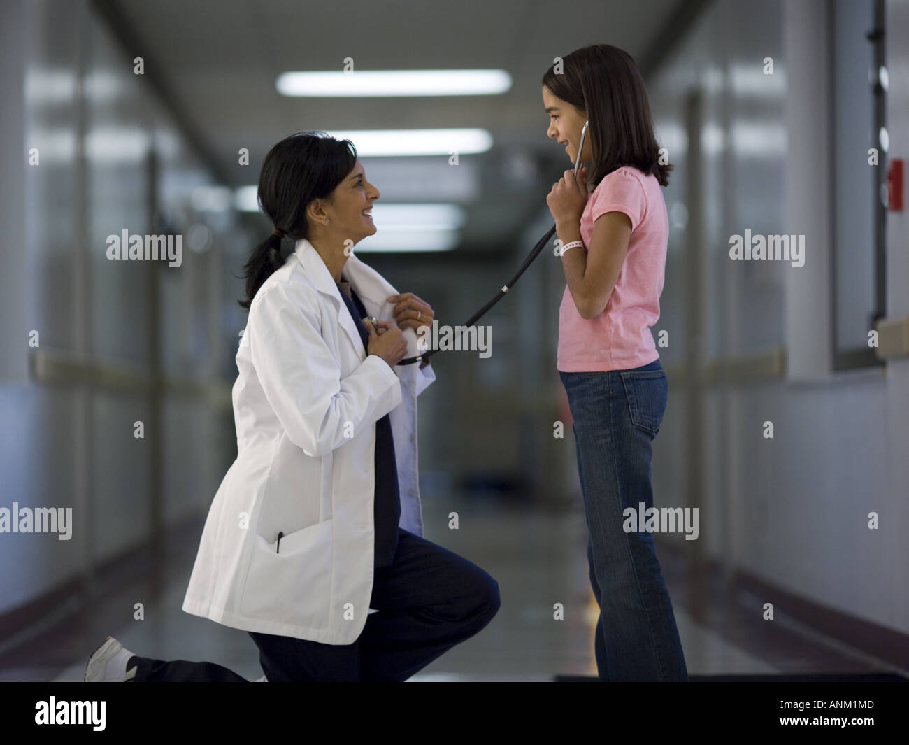Profile of a female patient checking a female doctor s heart beat Stock ...