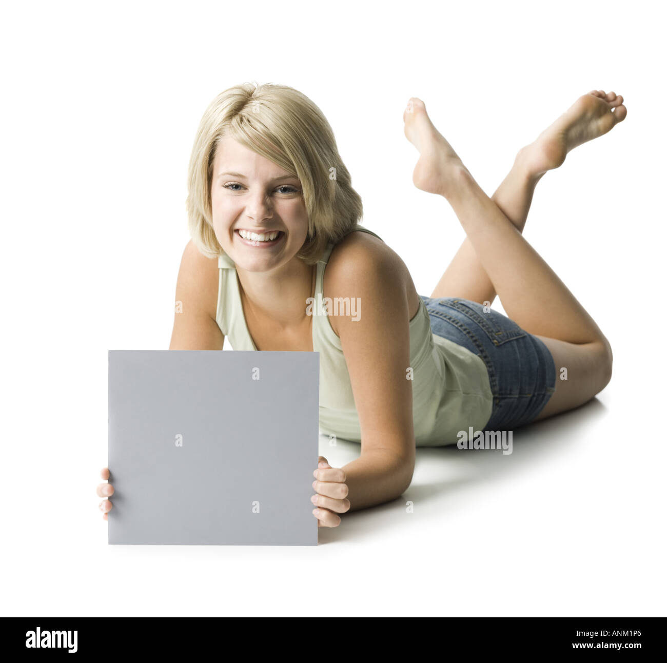 Portrait of a young woman showing a blank sign Stock Photo - Alamy