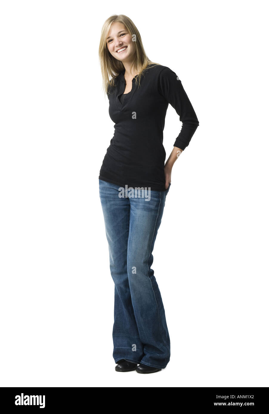 Portrait of a young woman with her hand on her hip Stock Photo - Alamy