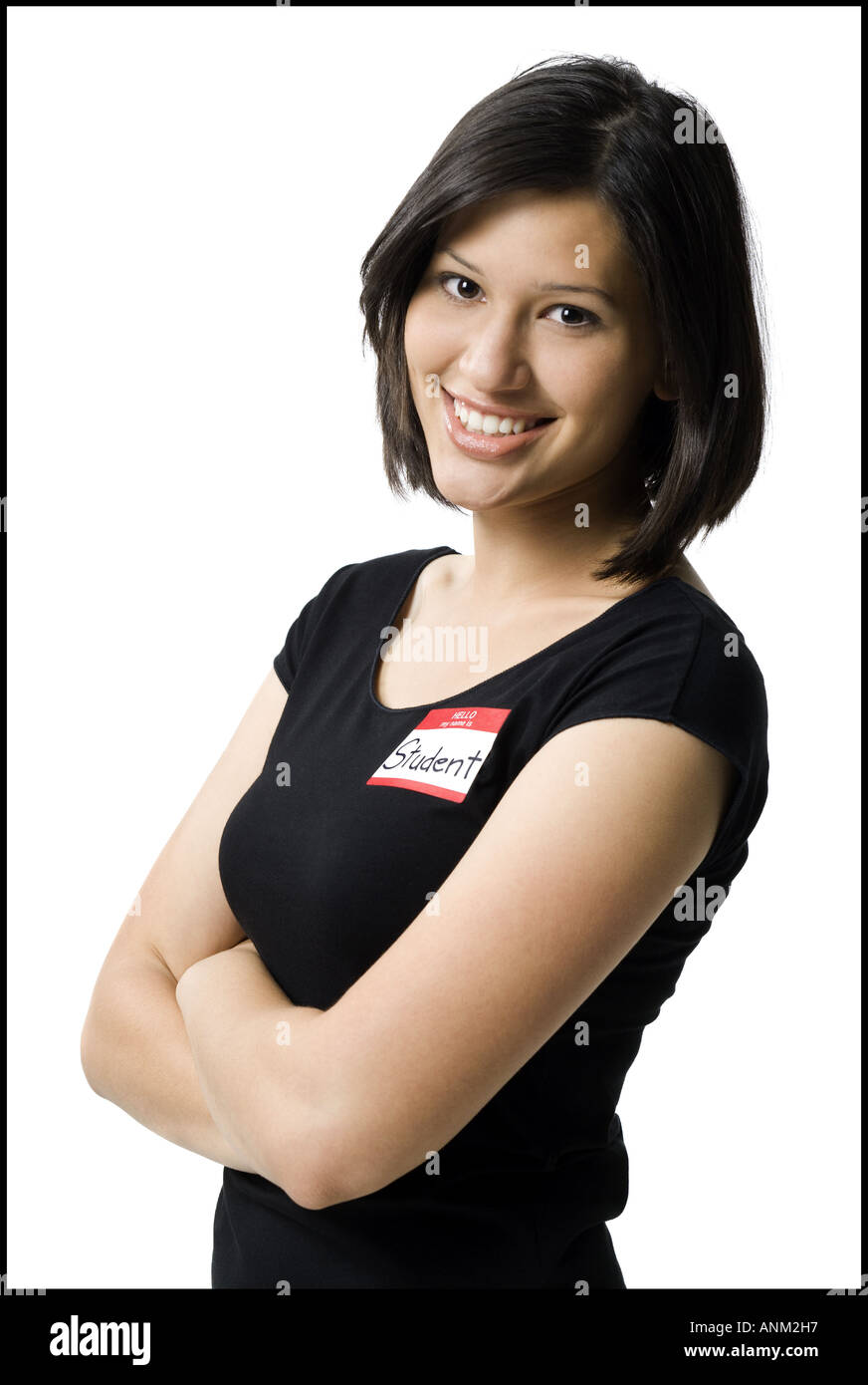 Portrait of a young woman with her arms crossed Stock Photo - Alamy
