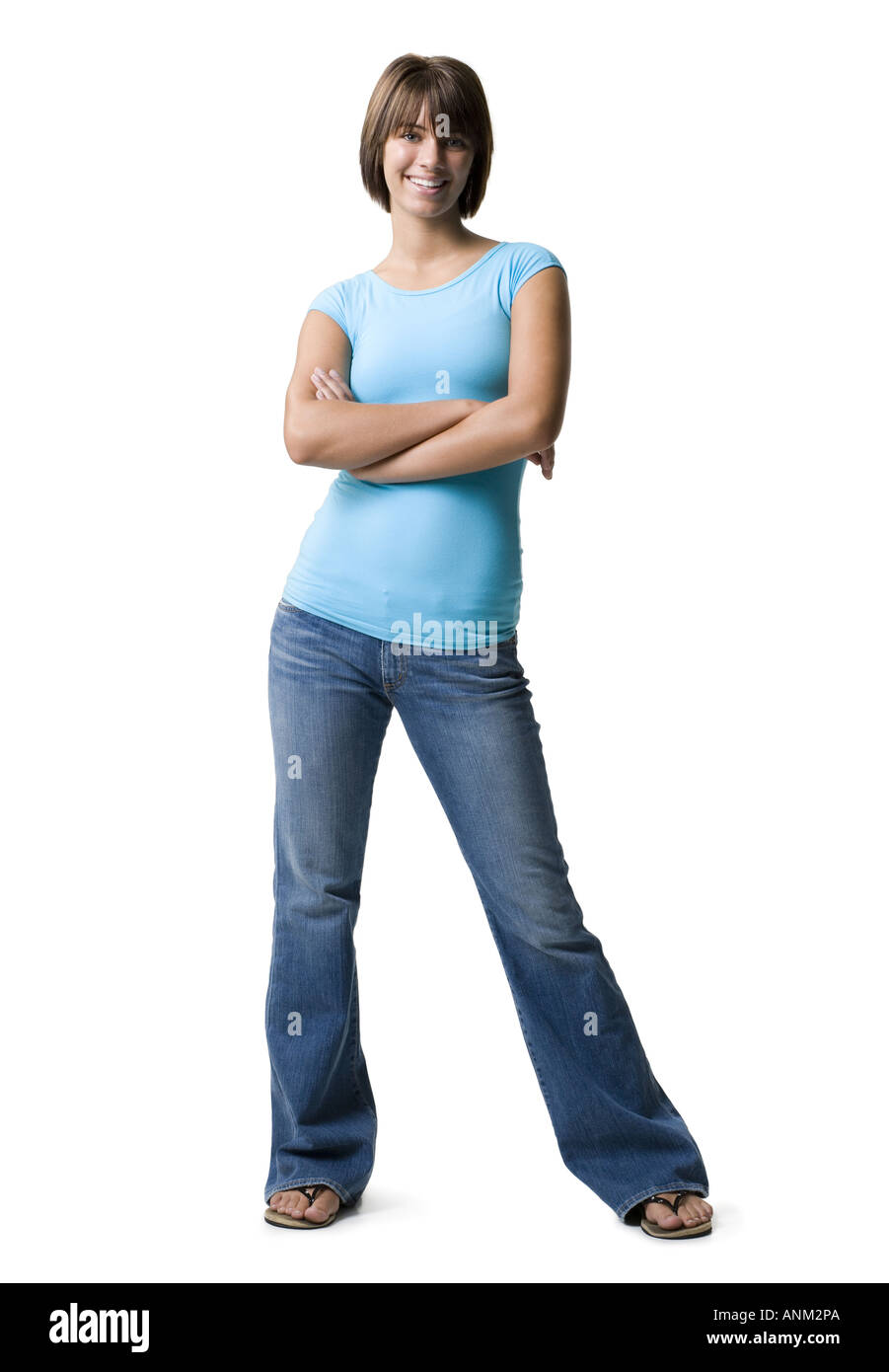 Portrait of a teenage girl smiling with her arms crossed Stock Photo ...
