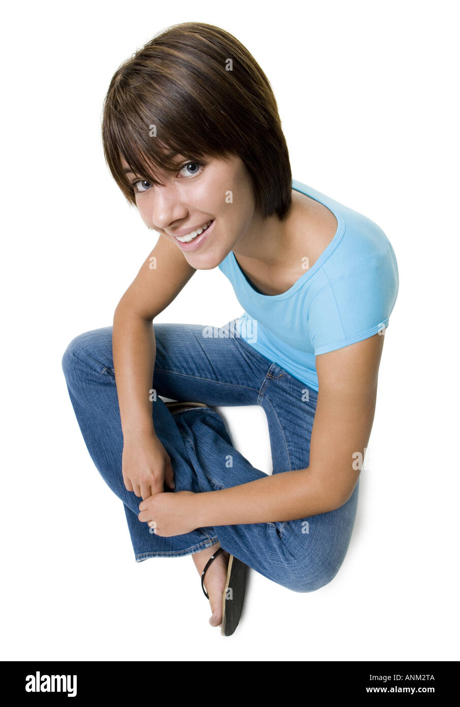 High angle view of a teenage girl sitting on the floor Stock Photo - Alamy