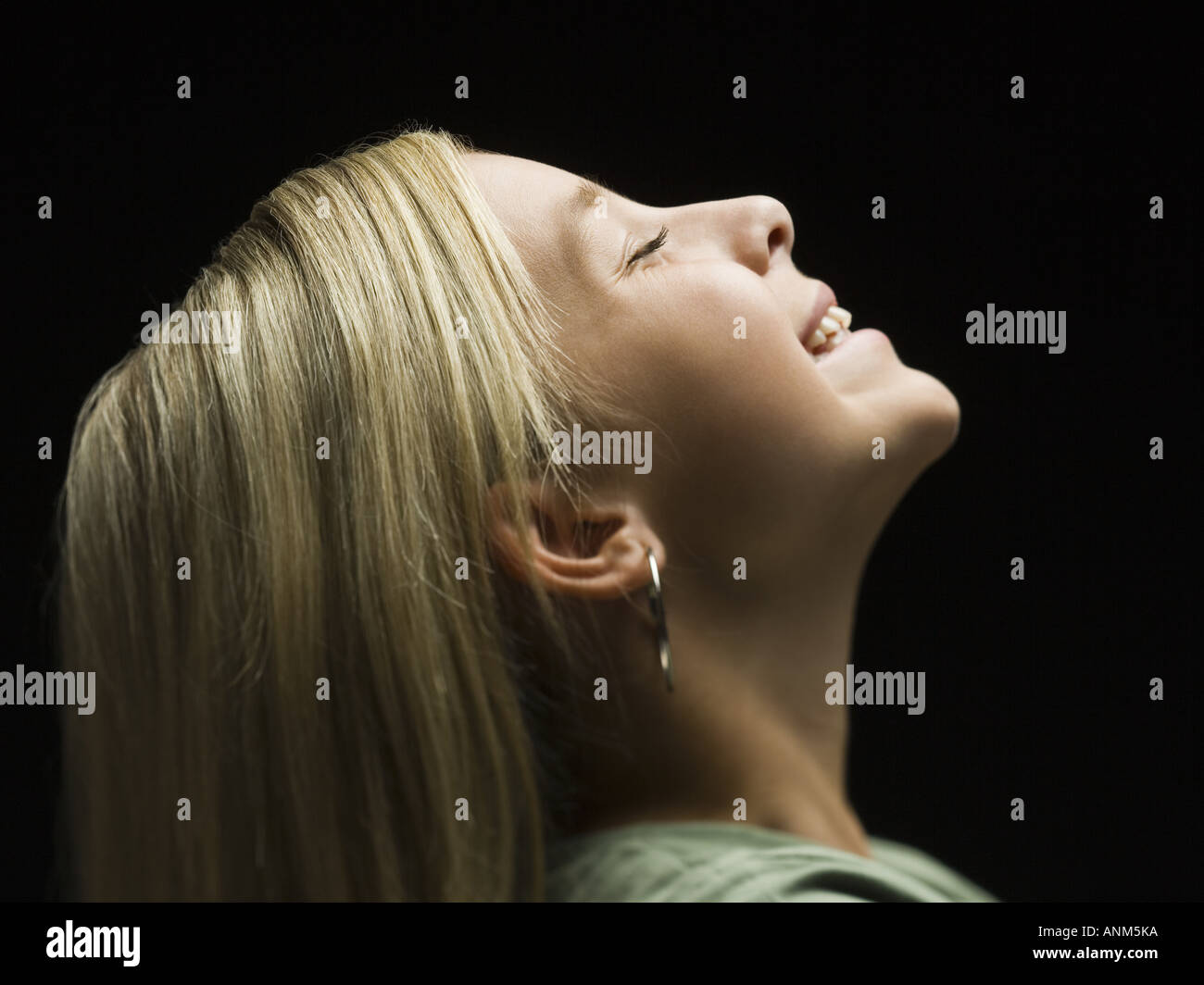 Profile of a girl smiling with her eyes closed Stock Photo - Alamy