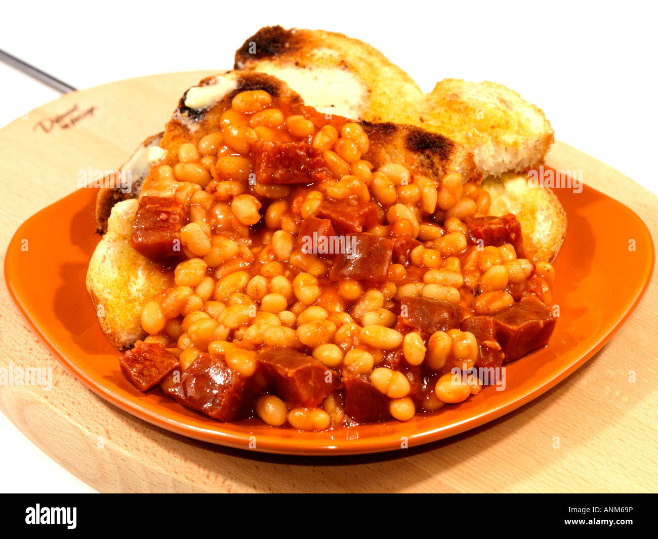 Beans and chorizo sausage on toast meal hires stock photography and