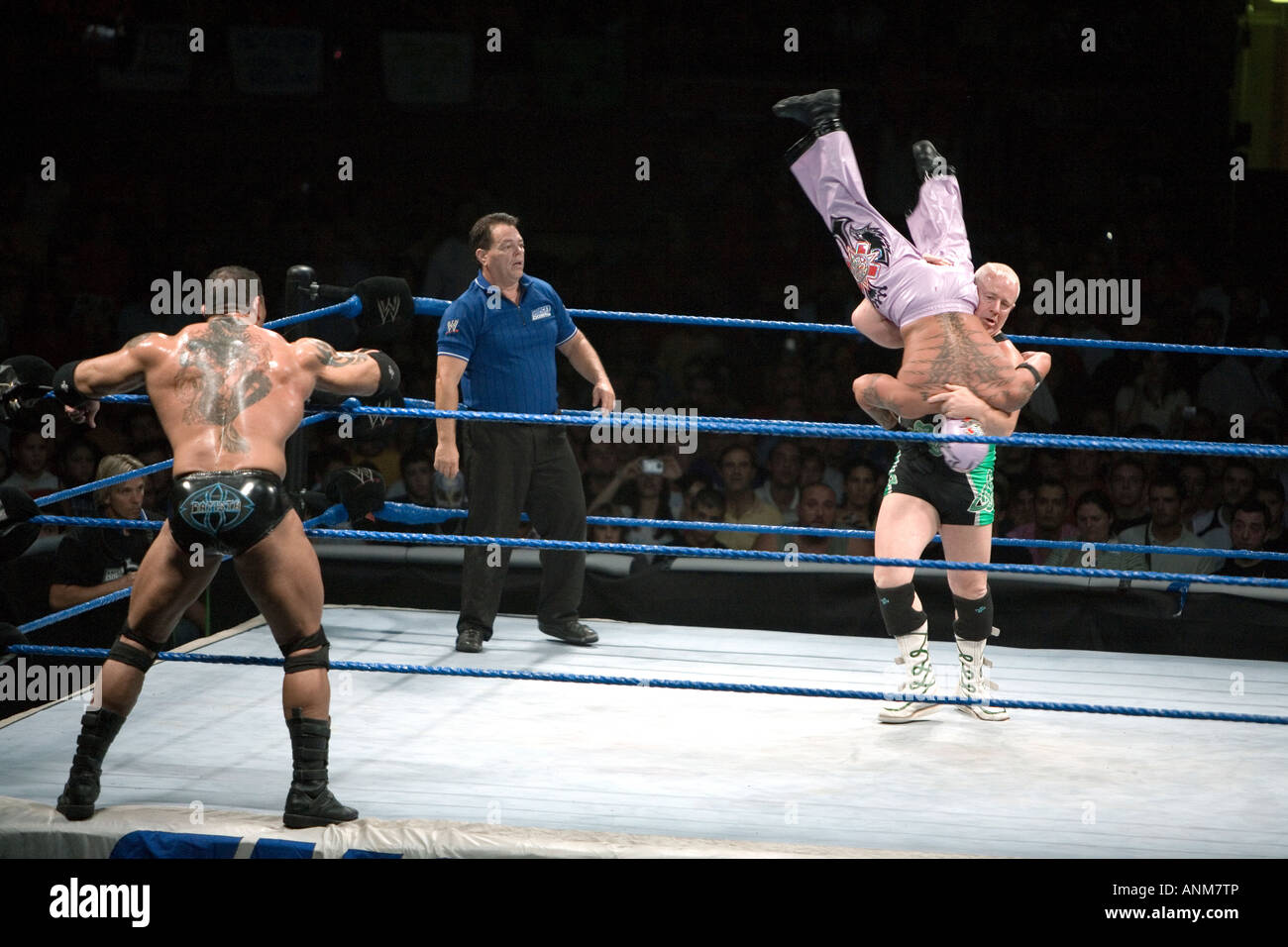 Finlay takes Rey Mysterio down during a fight at a WWE Smackdown event in Madrid, Spain. Stock Photo