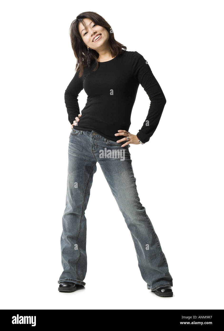 Portrait of a woman standing with her hands on her hips Stock Photo - Alamy
