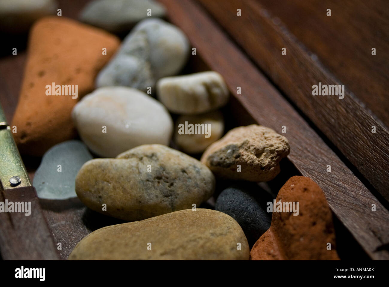 Set stones in a wooden box Stock Photo