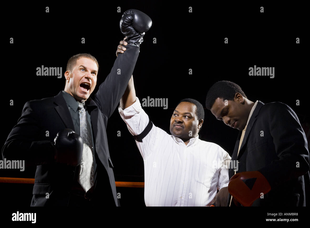 Referee declaring the winner of a boxing match Stock Photo