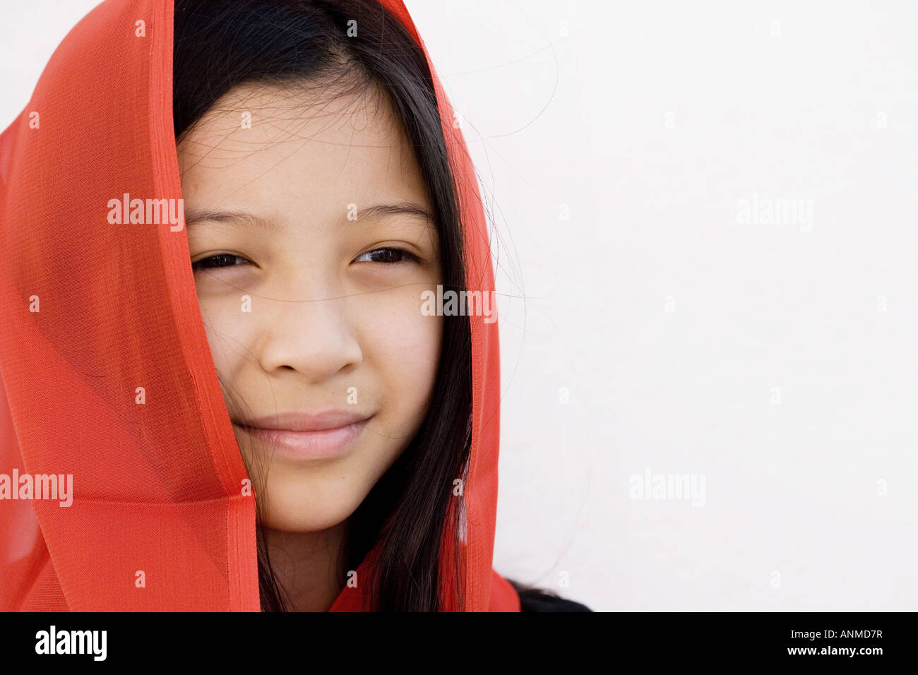 Oriental girl with red shawl Stock Photo