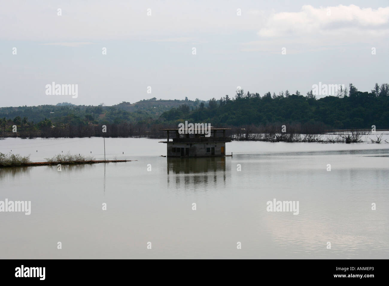 An isolated building surrounded by water after Tsunami in the backdrop of green hills at Jolly buoy Andaman Stock Photo