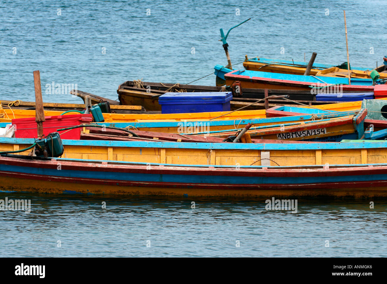 Fishing boats anchored in the blue waters at Jolly buoy Andaman Stock Photo
