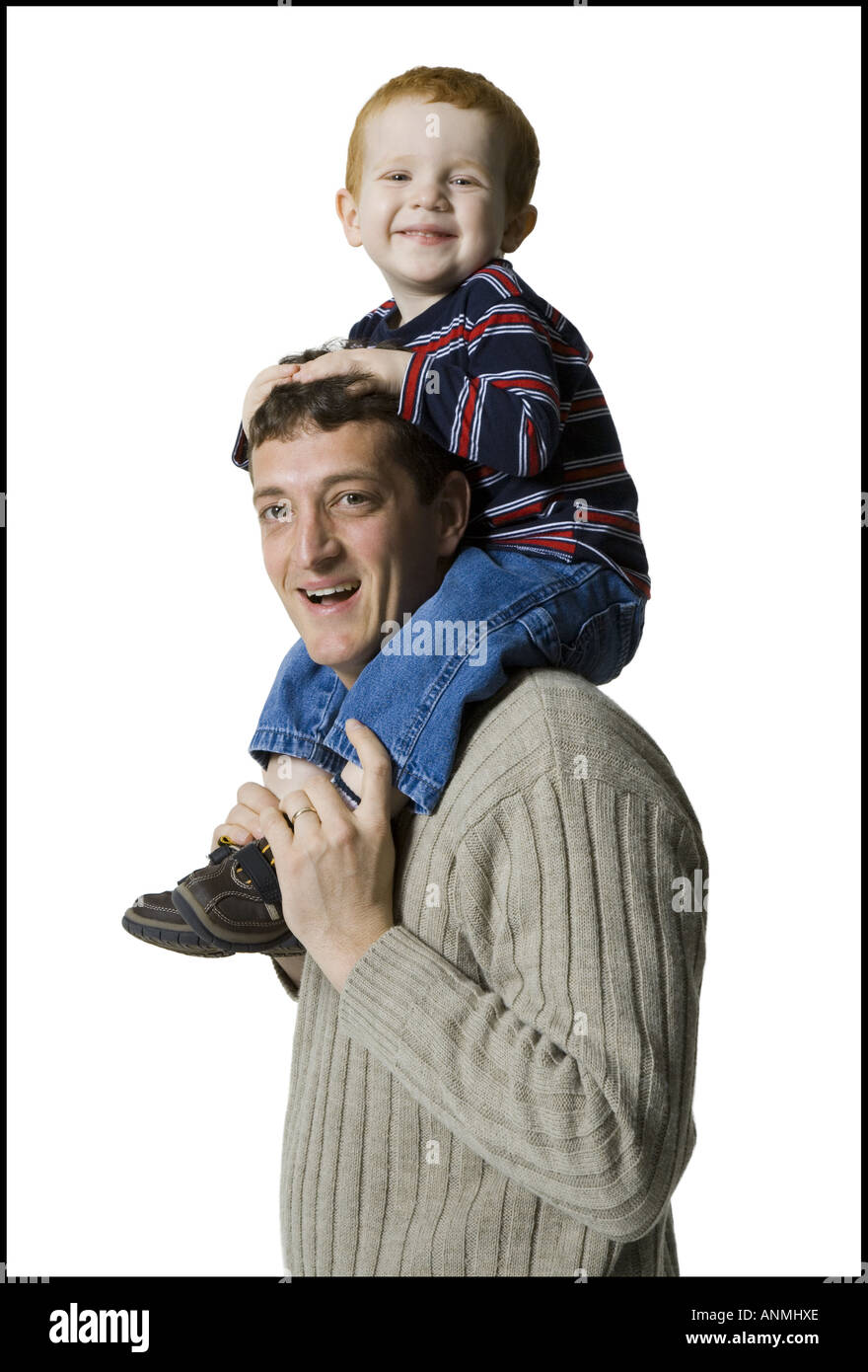 Profile of a father carrying his son on his shoulders Stock Photo - Alamy