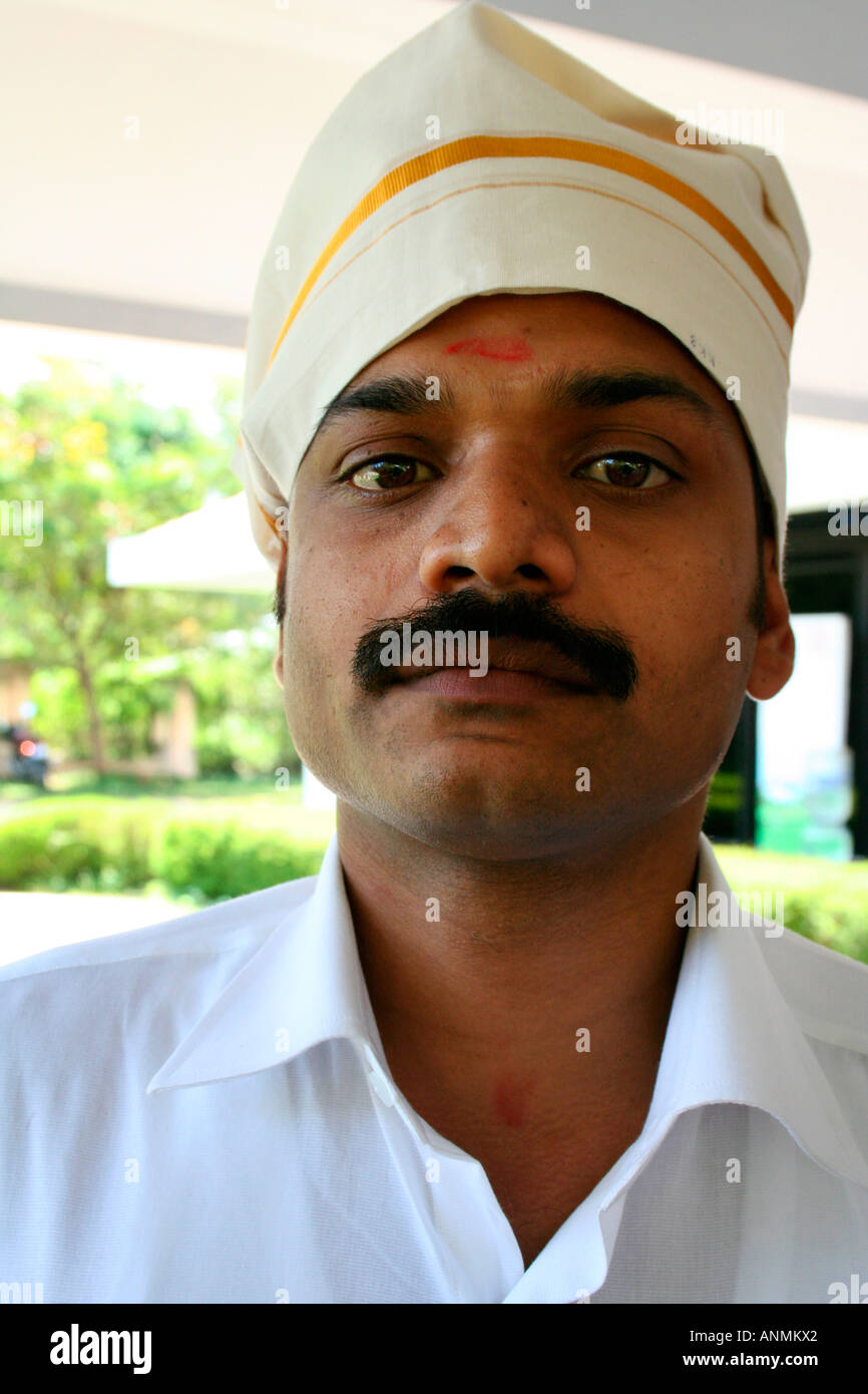 Close up a South Indian young man wearing a traditional Kerala style turban  on his head Stock Photo - Alamy