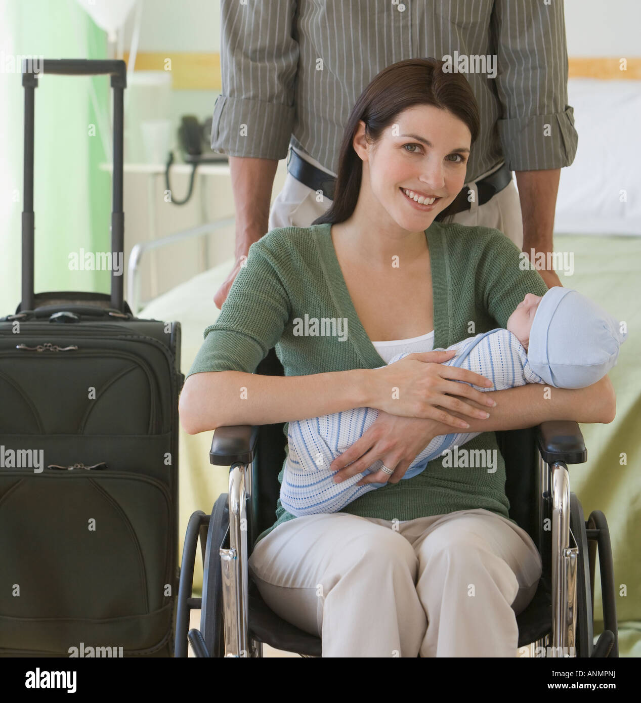 Parents leaving hospital with newborn Stock Photo Alamy