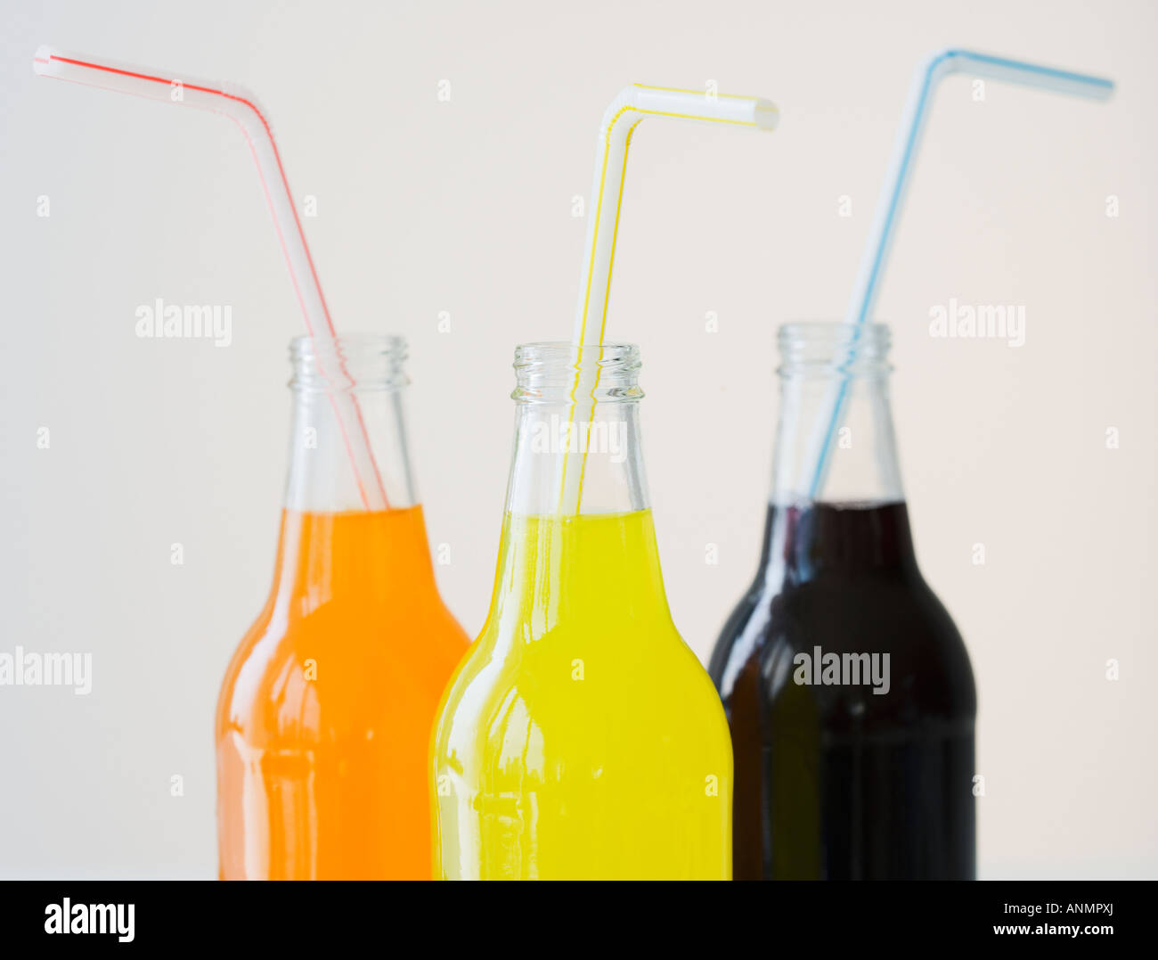 Glass soda bottles with straws Stock Photo Alamy