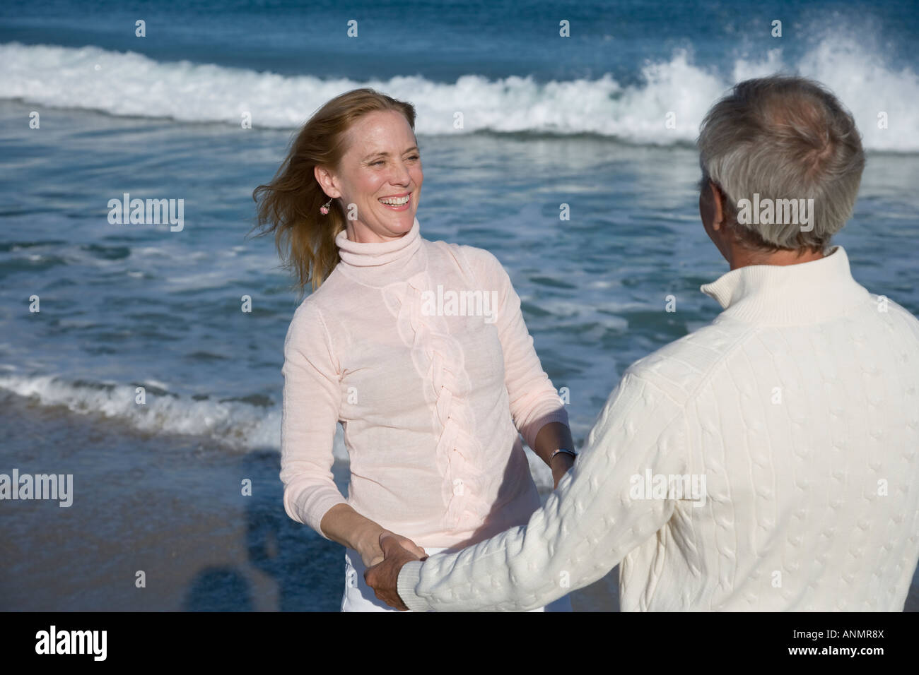 Family holding hands beach hi-res stock photography and images - Alamy