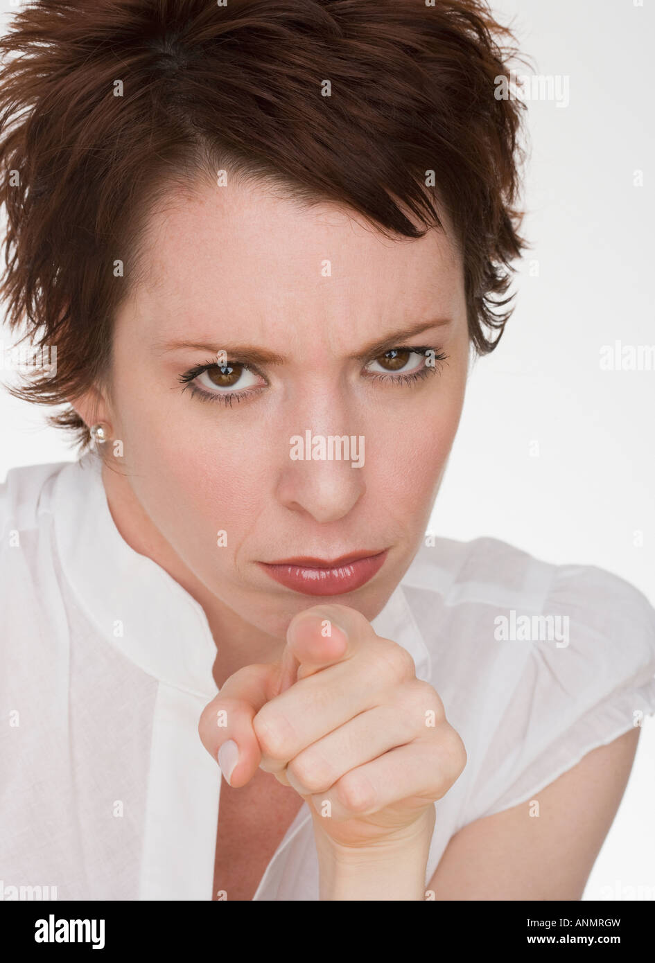 Angry woman pointing Stock Photo