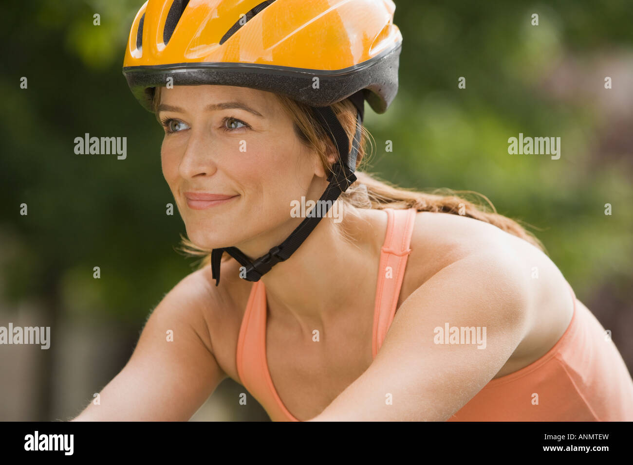 Woman wearing bicycle helmet Stock Photo Alamy