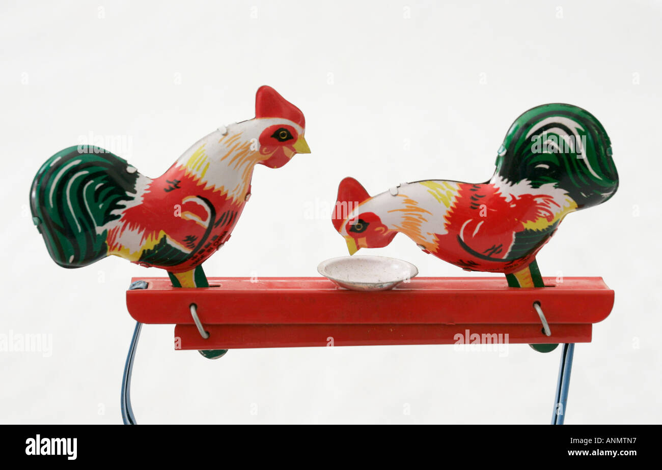 Two toy tin cockerel Stock Photo